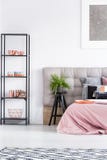 Plant on stool near bed stock photography Plant on stool near bed stock photography