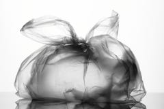 Plast- knuten påse med handtag arkivfoto Plast- knuten påse med handtag arkivfoto