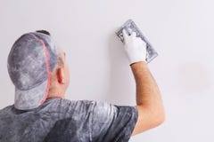 Plasterer polishing a gypsum wall Royalty Free Stock Image Plasterer polishing a gypsum wall Royalty Free Stock Image