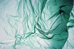 Plastic bag. Polyethylene may use as background. Template for card, poster, banner design. Green background. Space for your own royalty free stock image Plastic bag. Polyethylene may use as background. Template for card, poster, banner design. Green background. Space for your own royalty free stock image