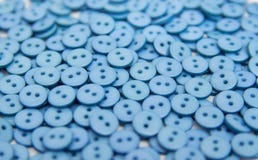 Plastic plastic buttons pellets scattered on a white background stock images Plastic plastic buttons pellets scattered on a white background stock images
