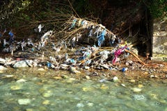 Plastic Garbage Polution in mountain stream Stock Images Plastic Garbage Polution in mountain stream Stock Images