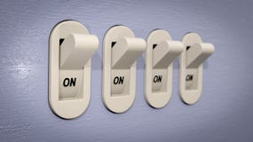 Plastic Light Switches In The ON Position Royalty Free Stock Photos