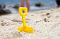 Plastic spade on the beach Plastic spade on the beach