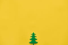 Plastic Toy Pine Wood Tree On Yellow Background. Minimal Flat Lay Of Christmas Season. Copy Space Royalty Free Stock Image Plastic Toy Pine Wood Tree On Yellow Background. Minimal Flat Lay Of Christmas Season. Copy Space Royalty Free Stock Image