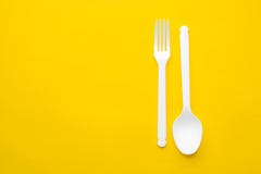 Download Plastic White Spoon And Fork On Yellow Background Cooking Utensil Cutlery Sign Top View Minimalist Style Copy Empty Space Stock Photo Image Of Color Background 166888524 Yellowimages Mockups