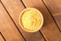 A plate of cornflakes on a wooden table. The concept of healthy stock image A plate of cornflakes on a wooden table. The concept of healthy stock image