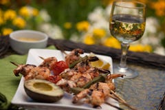 Grilled Shrimps Skewers for Dinner in Garden Stock Images Grilled Shrimps Skewers for Dinner in Garden Stock Images