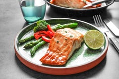 Plate with tasty cooked salmon on tabe, Royalty Free Stock Images Plate with tasty cooked salmon on tabe, Royalty Free Stock Images