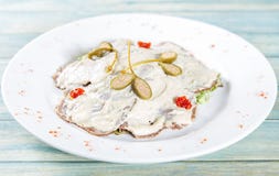 Plate of vitello tonato - veal with tuna sause and capers royalty free stock images Plate of vitello tonato - veal with tuna sause and capers royalty free stock images