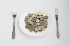 Plate With Coins Stock Images