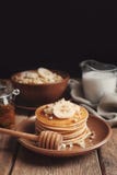 Plate with yummy banana pancakes on table stock photos Plate with yummy banana pancakes on table stock photos
