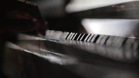 Players hand tounching piano keys and closing keyboard. Players hand tounching piano keys and closing keyboard.