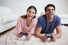 playful-couple-playing-video-games-22236196.jpg