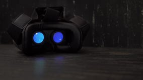 Playing movie inside virtual reality device at night with copy space. 4k UHD