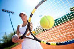 Playing tennis