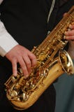 Playing The Saxophone Royalty Free Stock Photography Playing The Saxophone Royalty Free Stock Photography