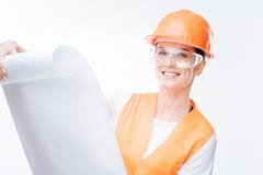 Pleasant female architect working at building site Royalty Free Stock Photography Pleasant female architect working at building site Royalty Free Stock Photography