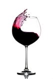 Plons van rode wijn in een glas royalty-vrije stock afbeelding Plons van rode wijn in een glas royalty-vrije stock afbeelding
