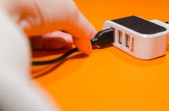 Pluging cable into a adapter royalty free stock image Pluging cable into a adapter royalty free stock image