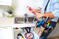 Plumber On The Kitchen. Royalty Free Stock Images Plumber On The Kitchen. Royalty Free Stock Images