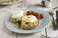 Poached eggs and avocado on toast stock images Poached eggs and avocado on toast stock images
