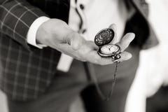 Pocket watch in a man`s hand royalty free stock images Pocket watch in a man`s hand royalty free stock images