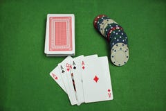 Poker Chips and cards on the baize stock photos Poker Chips and cards on the baize stock photos