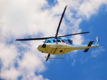 Police Helicopter In Action, Propellers Are Turning And The Machine Is Flying. Royalty Free Stock Photography Police Helicopter In Action, Propellers Are Turning And The Machine Is Flying. Royalty Free Stock Photography