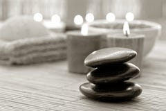 Polished Stone Cairn and Candles Burning in a Spa stock images Polished Stone Cairn and Candles Burning in a Spa stock images