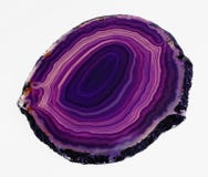Polished translucent slice of banded purple agate