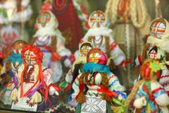 Motankas - traditional ukrainian dolls on display in toy shop window. Symbol of fertility and household guardians,they have no fac royalty free stock images Motankas - traditional ukrainian dolls on display in toy shop window. Symbol of fertility and household guardians,they have no fac royalty free stock images