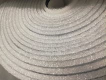 Polyethylene Insulation isolation foam with aluminum foil in rolls in store royalty free stock photography Polyethylene Insulation isolation foam with aluminum foil in rolls in store royalty free stock photography