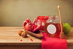 Pomegranate and honey for Rosh Hashanah holiday. Jewish New Year. stock photos Pomegranate and honey for Rosh Hashanah holiday. Jewish New Year. stock photos