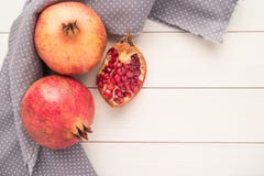 Pomegranates over grunge wooden background royalty free stock image Pomegranates over grunge wooden background royalty free stock image