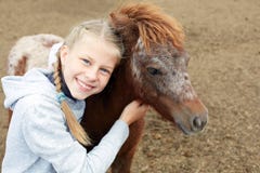 Pony and little girl and her best friend Stock Photography Pony and little girl and her best friend Stock Photography