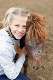 Pony and little girl and her best friend Stock Photos Pony and little girl and her best friend Stock Photos