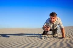 Poor signal. businessman searching for mobile phone signal in desert Stock Photography Poor signal. businessman searching for mobile phone signal in desert Stock Photography