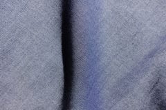 Popolare verticale sul tessuto delle blue jeans immagini stock libere da diritti Popolare verticale sul tessuto delle blue jeans immagini stock libere da diritti