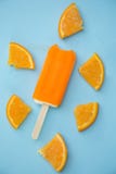Popsicle with fresh orange on a table Royalty Free Stock Photography Popsicle with fresh orange on a table Royalty Free Stock Photography