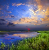 Por do sol rochoso do lago foto de stock royalty free Por do sol rochoso do lago foto de stock royalty free
