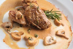 Pork medallions with mushroom sauce Royalty Free Stock Photography Pork medallions with mushroom sauce Royalty Free Stock Photography