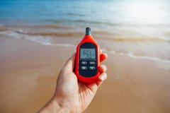 Portable thermometer in hand measuring outdoor air temperature and humidity Royalty Free Stock Image Portable thermometer in hand measuring outdoor air temperature and humidity Royalty Free Stock Image