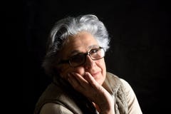 Portait of a senior woman on black royalty free stock image Portait of a senior woman on black royalty free stock image