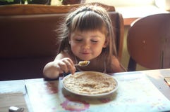Portrait of adorable little girl having lunch Royalty Free Stock Photo Portrait of adorable little girl having lunch Royalty Free Stock Photo
