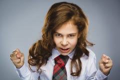 Portrait of angry girl with hands up yelling isolated on gray background. Negative human emotion, facial expression Stock Photos Portrait of angry girl with hands up yelling isolated on gray background. Negative human emotion, facial expression Stock Photos