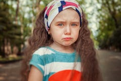 Portrait of angry and sad little girl. Children`s emotions royalty free stock photography Portrait of angry and sad little girl. Children`s emotions royalty free stock photography