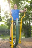 Portrait of asian man doing workout with elliptical machine Royalty Free Stock Photography Portrait of asian man doing workout with elliptical machine Royalty Free Stock Photography