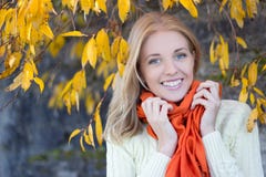 Portrait of attractive woman in white sweater smiling against st royalty free stock photo Portrait of attractive woman in white sweater smiling against st royalty free stock photo