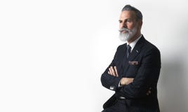 Portrait of bearded attractive gentleman wearing trendy suit over empty white background. Copy Paste text space. Royalty Free Stock Photo Portrait of bearded attractive gentleman wearing trendy suit over empty white background. Copy Paste text space. Royalty Free Stock Photo